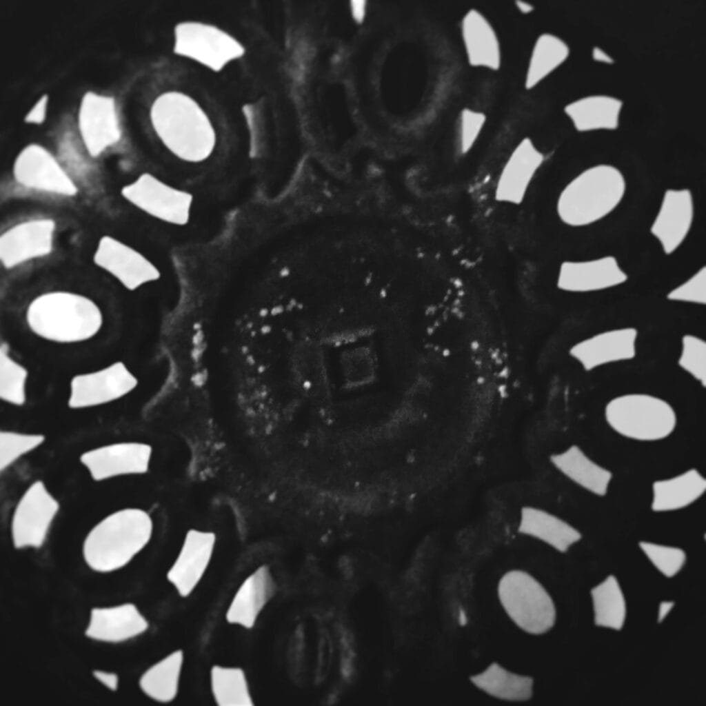 Close-up of the design of the lid of a Godin stove.