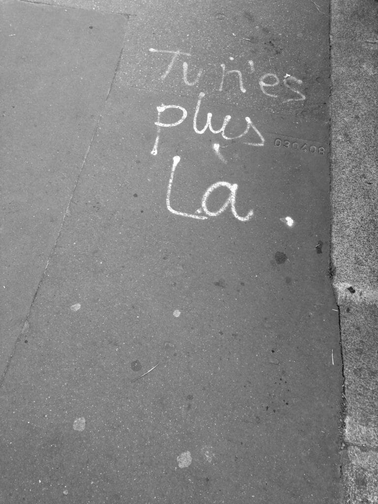 Tag on a sidewalk that reads 'You're gone.'