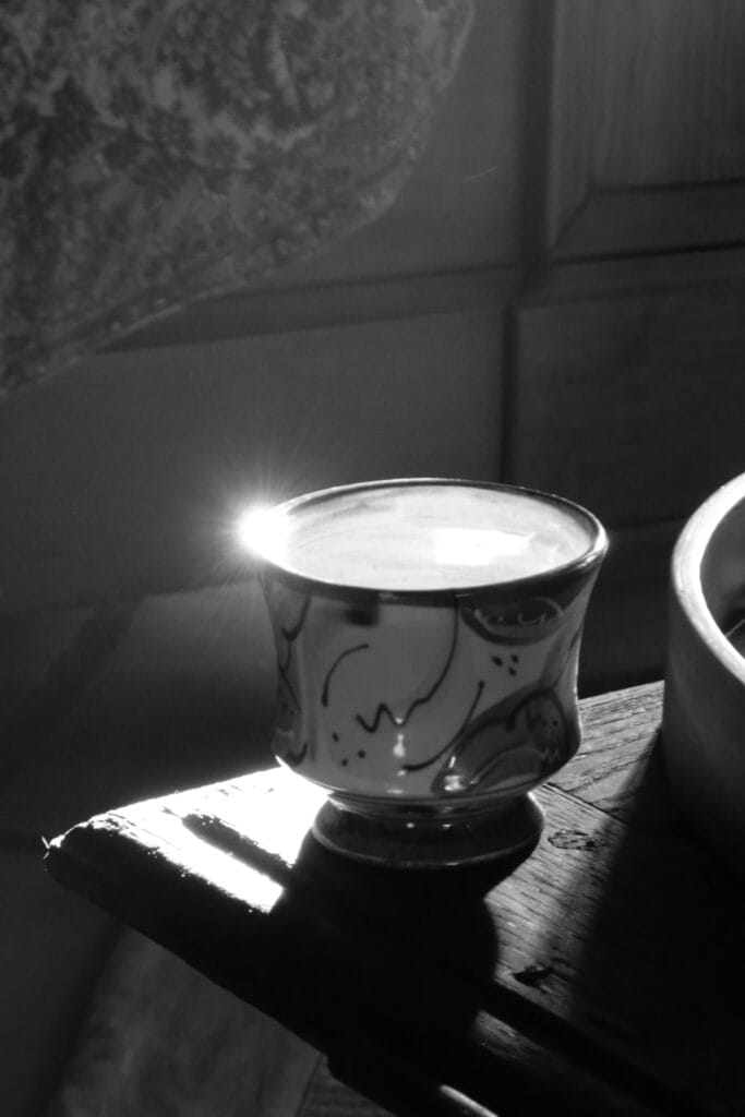 Reflection of the rising sun in a cup.