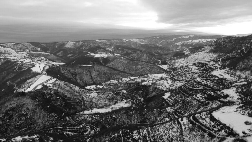 View of the legs of the Montagne Dinosaure, the Tarnon valley and the Can in the snow.