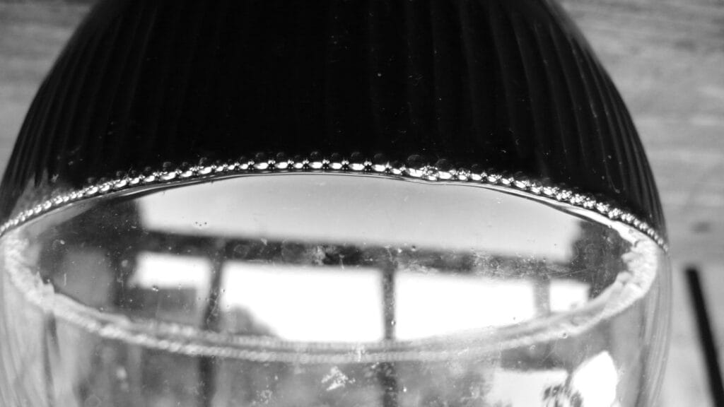 Red wine in a carafe with pretty bubbles on the surface.