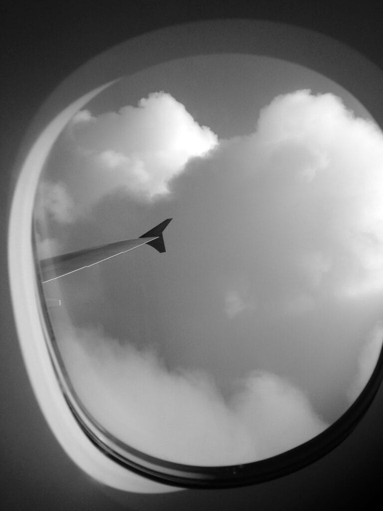 Fluffy clouds seen through the window.