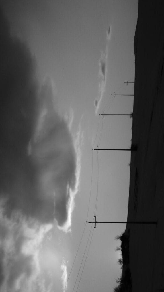 The telephone lines on top of the hill resemble a musical stave.