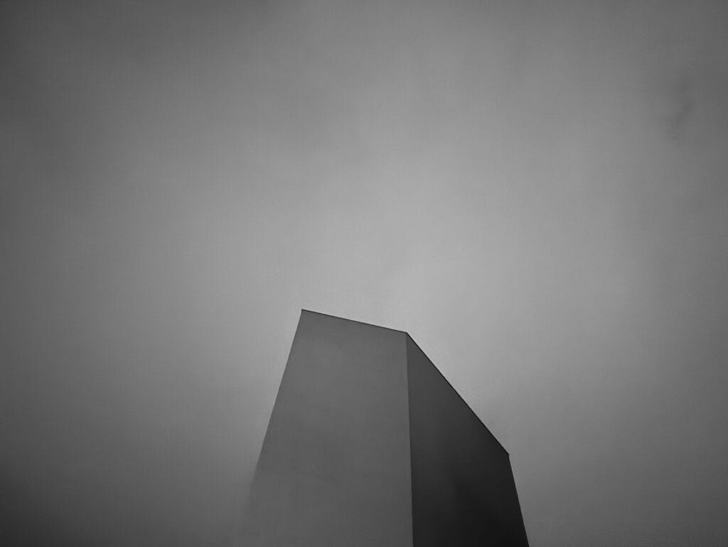 Top of a blind tower against a backdrop of a milky night sky.