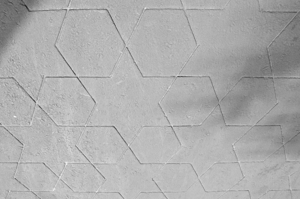A floor with six-pointed star patterns. With perspective, the nearest stars appear larger.