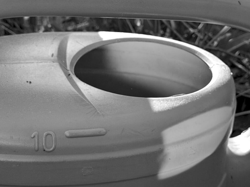 The top of a plastic watering can.