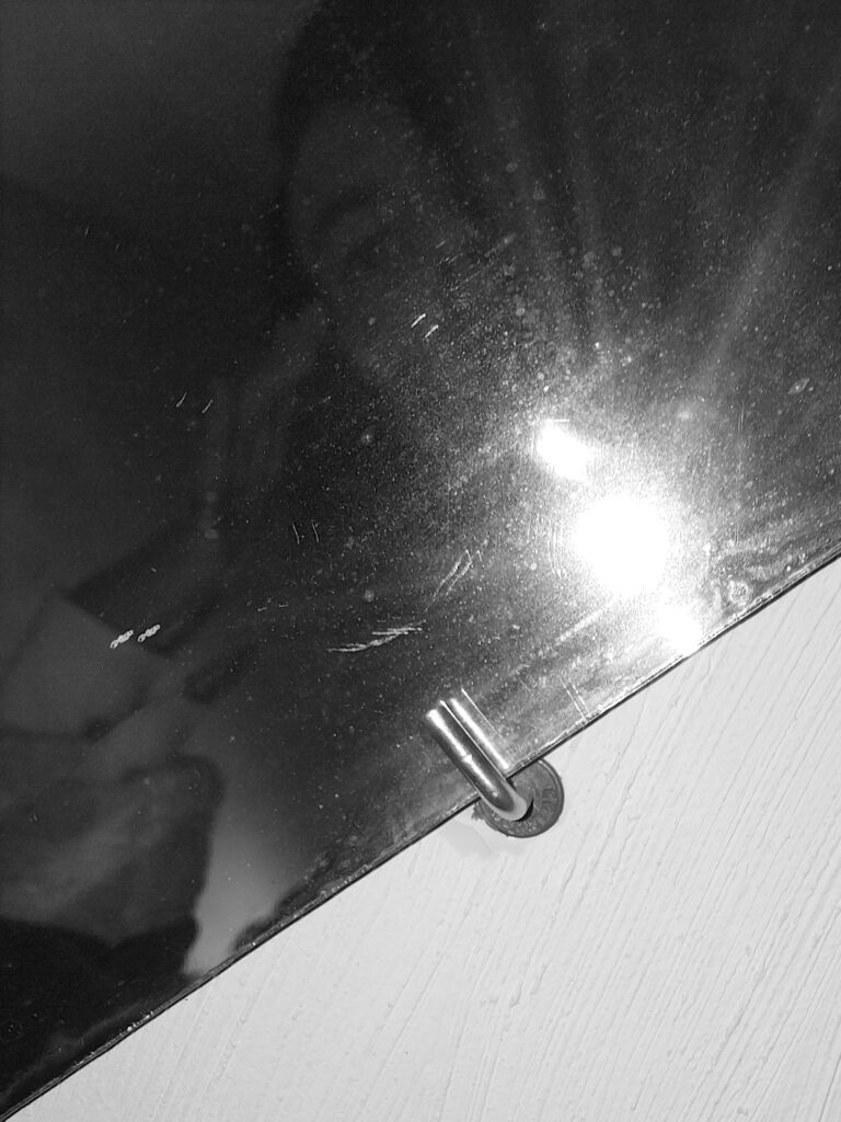 Self-portrait of the photographer in the mirror with a big flash.